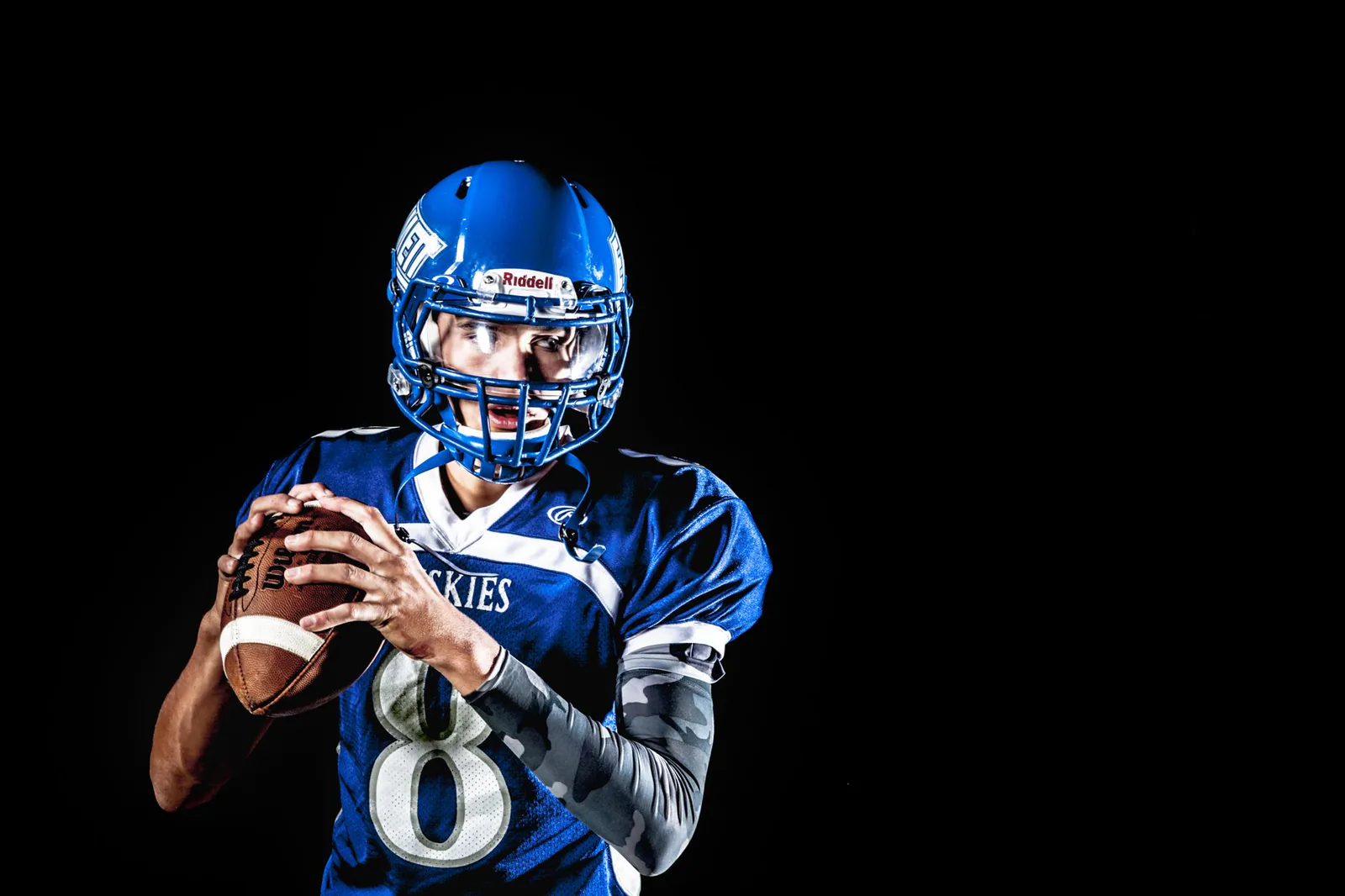 Quarterback poised to throw during a game
